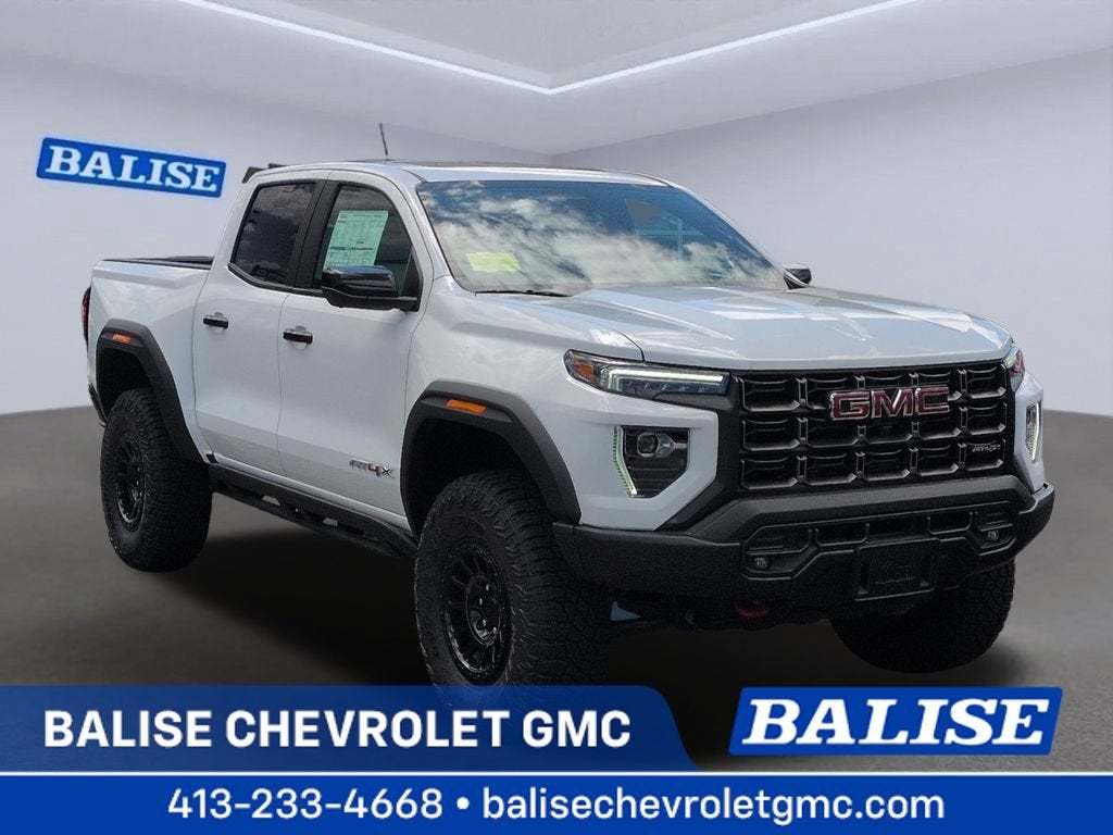 2026 GMC Canyon AT4X in Summit White — front three-quarter view