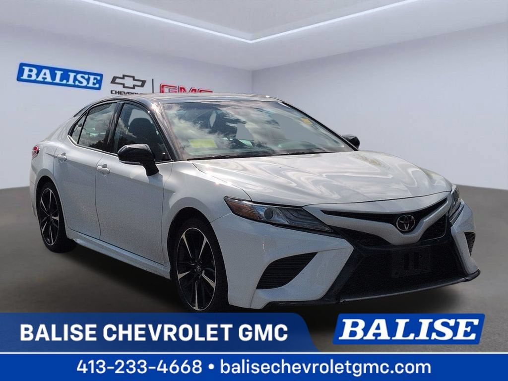 2019 Toyota Camry XSE in Black — front three-quarter view